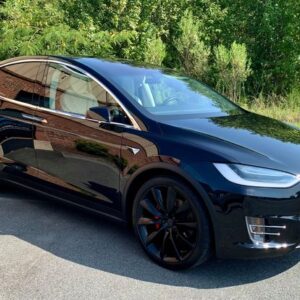 Black Tesla Model Y from the side with paint protection