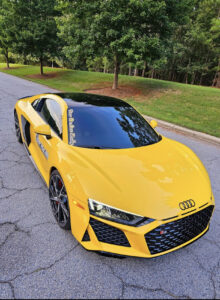 Yellow Audi R8 with a gloss black PPF wrap on the roof