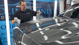 The preparation for paint protection film by spraying the surface of the vehicle
