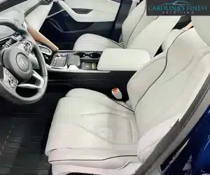 view of a detailed luxury car interior displaying pristine