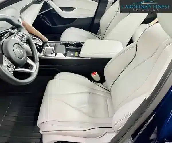 view of a detailed luxury car interior displaying pristine